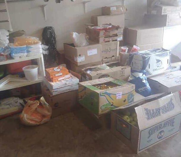 Boxes of food being sorted for community distribution