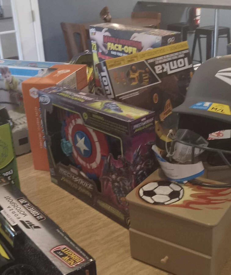 Picture of a stack of donated toys from Toys 4 Tots