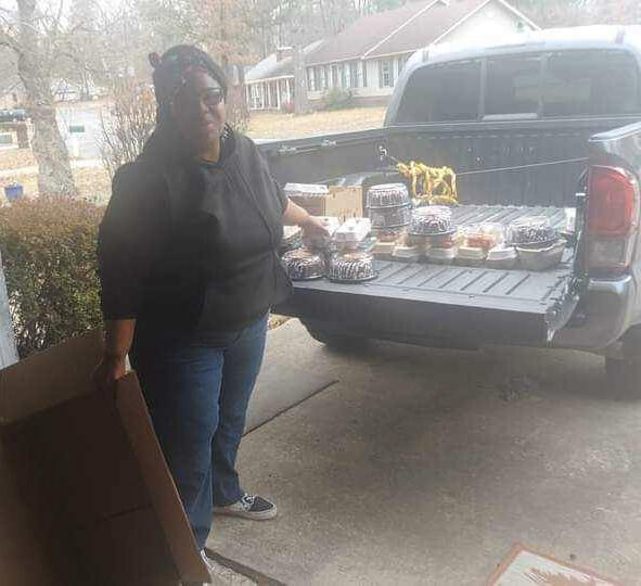 Food Unloading Jacqueline Doss-Cola is unloading food from a truck for distribution